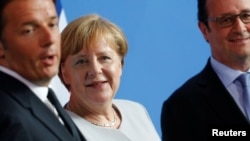 Italian Prime Minister Matteo Renzi with German Chancellor Angela Merkel (center), and French President Francois Hollande (right) in Berlin in June