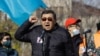 Ermurat Bapi speaks at a rally in Almaty on October 31.