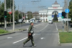 A separatist fighter on the streets of Donetsk in 2014.