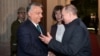 Hungarian Prime Minister Viktor Orban (left) shakes hands with Russian President Vladimir Putin during a meeting in Budapest in October 2019.