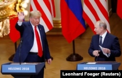 Then-U.S. President Donald Trump and Russian President Vladimir Putin at a joint news conference after their meeting in Helsinki on July 16, 2018