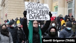 People take part in a protest rally in support of detained opposition leader Aleksei Navalny in Moscow on January 31.