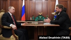 Russian President Vladimir Putin (left) meets with Chechen leader Ramzan Kadyrov at the Kremlin on April 19.