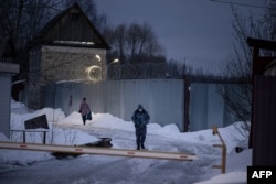 A security guard outside Correctional Colony No. 2 where Navalny is being held, in the town of Pokrov, outside Moscow.