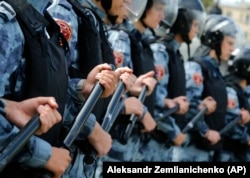 Russian police block a square during an unsanctioned rally in the center of Moscow on August 3.