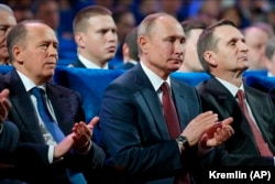 President Vladimir Putin (center), FSB Director Aleksandr Bortnikov (left), and SVR chief Sergei Naryshkin attend a meeting with intelligence officers in Moscow in December 2019.