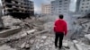 A man looks at destroyed buildings hit by Israeli air strikes in Beirut on the anniversary of the deadly October 7 Hamas attack on Israel. 