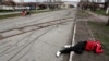 The body of a civilian lies in the street in the southern port city of Mariupol. Four Russian filtration camps are reportedly operating in the city.