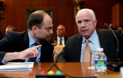 Kara-Murza (left) and Senator John McCain prepare to testify before a Senate subcommittee hearing on Civil Society Perspectives On Russia in 2017.