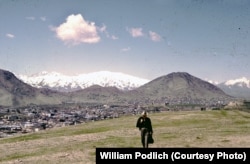 William Podlich strolls on a hillside outside of Kabul.