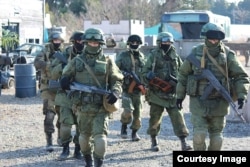 Japanese "airsoft" players dressed in the uniforms of the notorious “little green men” -- unmarked Russian soldiers involved in the 2014 annexation of Crimea.