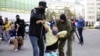 A photo of Belarusian security officers arresting a protester in Minsk that was taken by TUT.by, which was one of several online media outlets blocked by the authorities this year. 