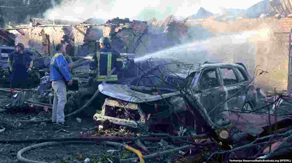 Firefighters hose down the smoking aftermath of a blast site in&nbsp;Zaporizhzhya.