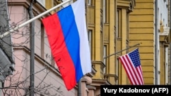 A Russian flag hangs at a building next to the U.S. Embassy in Moscow. (file photo)