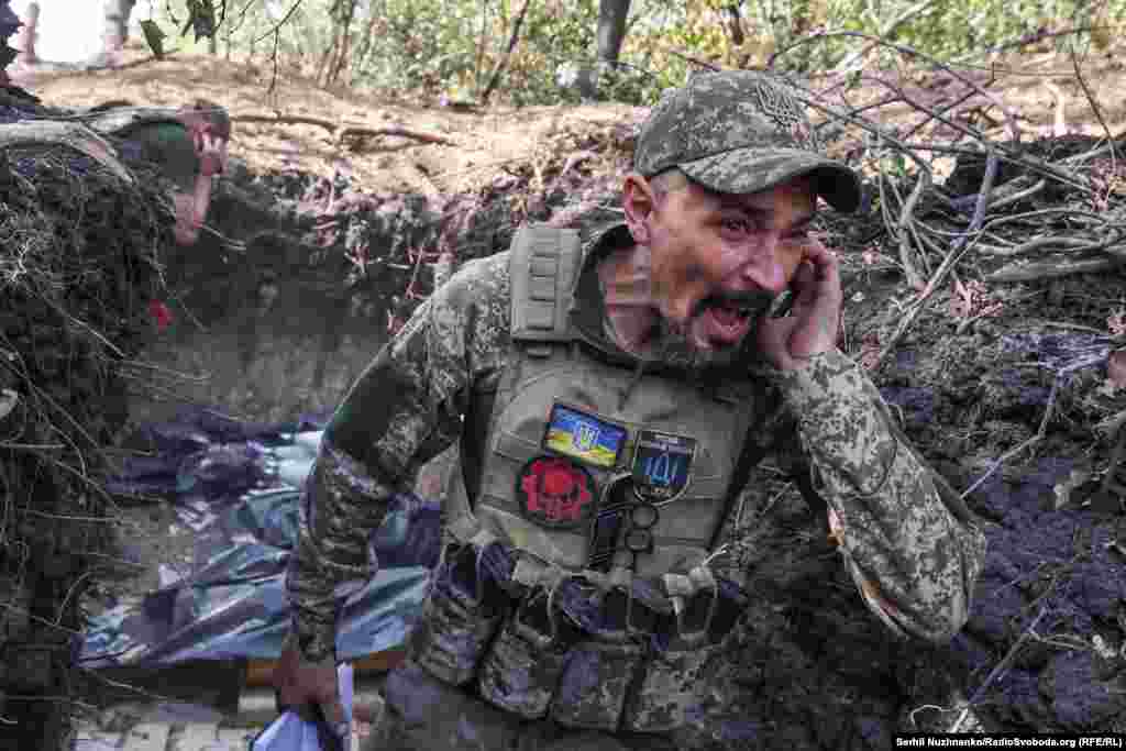 Artem, a 40-year-old Ukrainian commander, shouts a warning before his artillery team fires toward Russian positions near Pokrovsk in early October 2024. &nbsp;