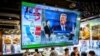 A TV screen showing preliminary results for the U.S. presidential election hangs in a restaurant in Hong Kong on November 6. 