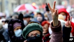 Pensioners and other march in an opposition rally in Minsk on November 16.