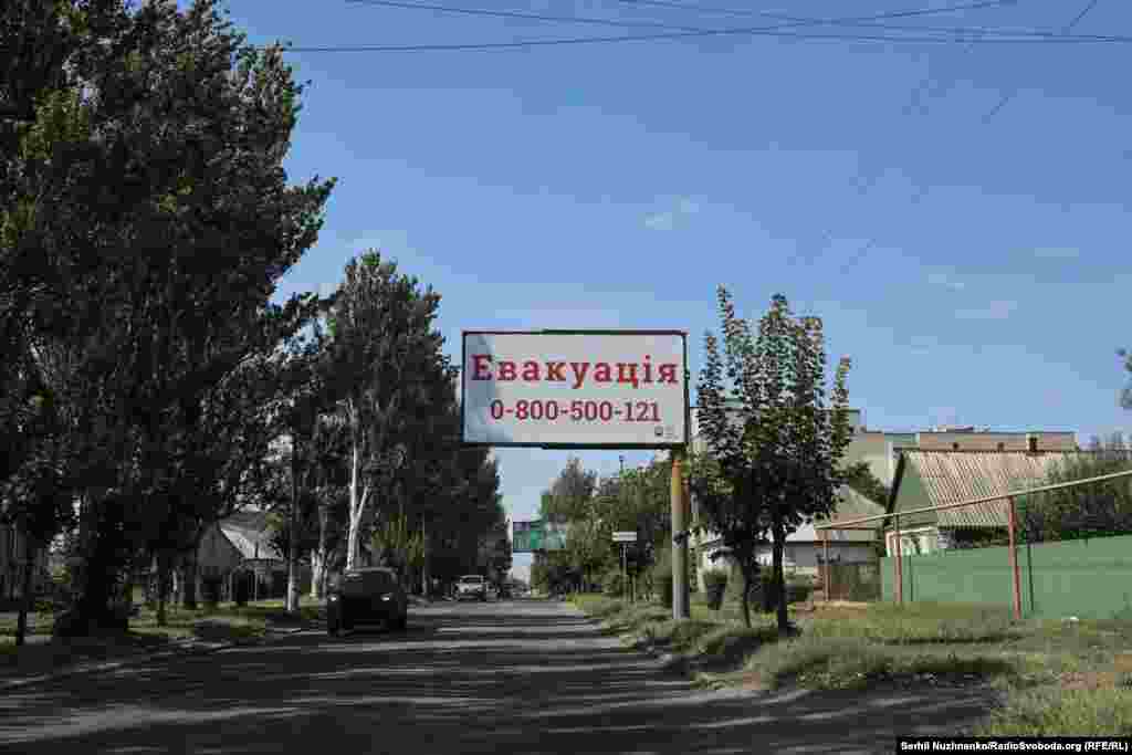 A sign advertises assistance with evacuation out of Pokrovsk on a street in the eastern Ukrainian city in late September 2024.&nbsp; 