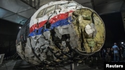 The reconstructed wreckage of the MH17 airliner is displayed after the presentation of the final report into the crash of July 2014 of Malaysia Airlines Flight 17 over Ukraine in October 2015.