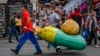 Migrant laborers work at a market in Moscow in 2021.