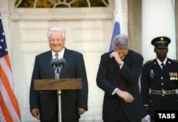 Clinton and Yeltsin share a laugh during a press conference after a meeting in New York on October 23, 1995.