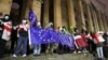 Supporters of Georgia's opposition parties protest in Tbilisi on December 2 against the government's decision to suspend talks on joining the European Union. 