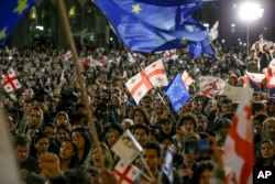 Tens of thousands of Georgians took to the streets of Tbilisi throughout the spring to protest the passage of the law.