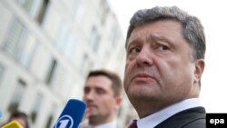 Ukrainian presidential frontrunner Petro Poroshenko gives a statement to the media earlier this month. A new report has given qualified approval to the press's coverage of the presidential election campaign. 