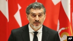 Georgian President-elect Mikheil Kavelashvili speaks at his swearing-in ceremony at the Georgian Parliament in Tbilisi on December 29.