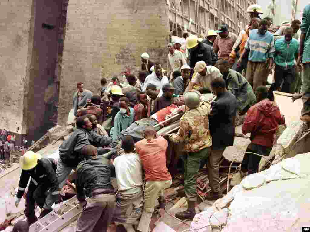 Rescue workers remove the bodies of people who died when a bomb exploded near the U.S. Embassy in Nairobi in August 1998, an attack credited to Al-Qaeda. More than 200 were killed.