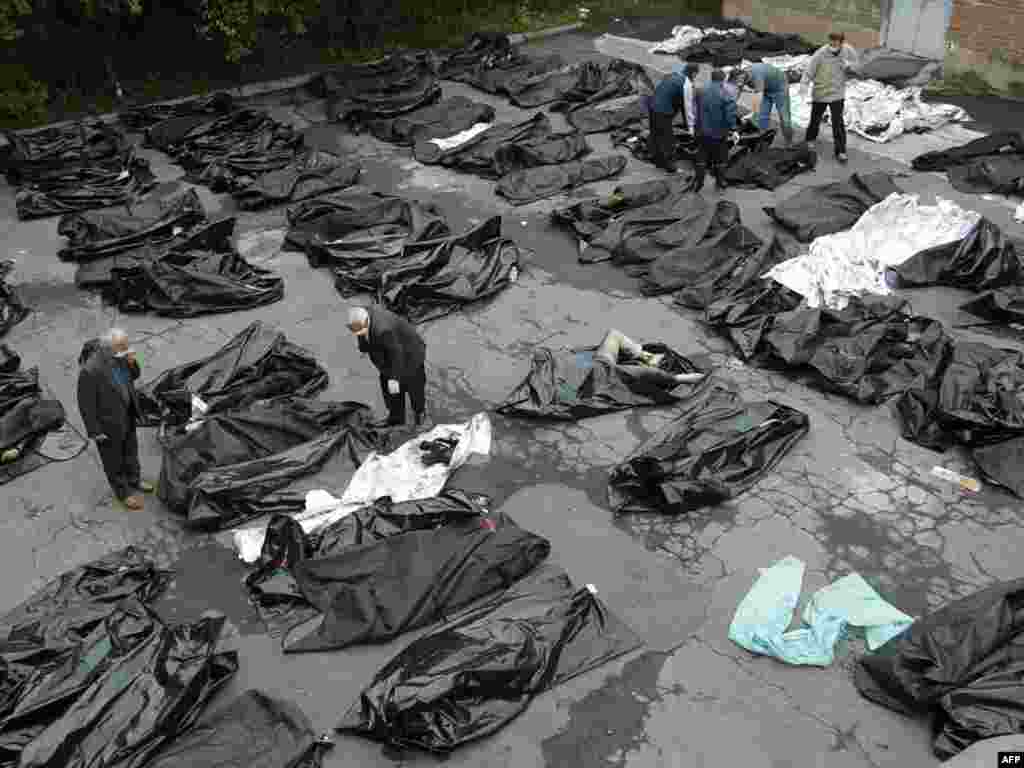 Relatives try to identify the bodies of victims outside a morgue in Vladikavkaz.