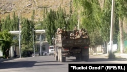 Tajik military patrols in Khorugh in 2012 -- the mutual distrust between local leaders and the central government has a long history.