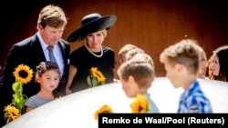 Dutch King Willem-Alexander (left) and his wife Queen Maxima attend an event to unveil a national monument commemorating the victims of the Malaysia Airlines crash in Ukraine, in Vijfhuizen, the Netherlands. 