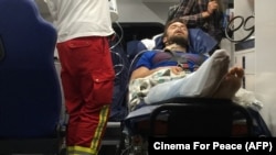 Verzilov is seen in an ambulance after arriving in Berlin for treatment on September 15.