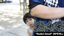 As many Tajik children lose both their parents to labor migration, this is placing an increasing burden on other family members left behind to look after them. (file photo)