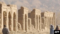 Afghans walk in the old city of Bamiyan, on an old Silk Road trade route.