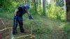 A deminer looks for buried ordnance on Trebevic mountain near Sarajevo in September. Years of harsh weather conditions have muddled what few maps authorities have of mined areas.