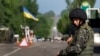 A Ukrainian Army soldier mans a roadblock north of the eastern town of Slovyansk.