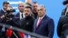 Hungarian Prime Minister Viktor Orban (right) welcomes Ukrainian President Volodymyr Zelenskiy (center) in Budapest on November 7.