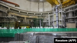 Employees fuel up the first of two reactors of Belarus's Ostrovets nuclear power plant during its launch on August 7, 2020. It was the first nuclear power plant in Belarus.