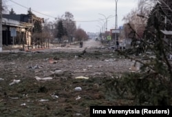 Debris on a road near buildings damaged by Russian military strikes in Pokrovsk in Ukraine's Donetsk region.