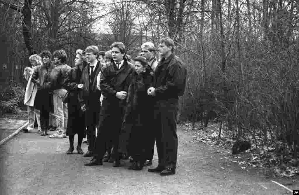 Relatives of Chris Geoffroy, including his mother, Karin (front right), attend his funeral in East Berlin. Geoffrey was the last person to be shot dead while trying to flee East Berlin after making a dash for the wall in February 1989. The Berlin wall came down, effectively ending the reign of the East German communist regime, on November 9, 1989.&nbsp;