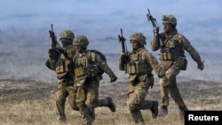 NATO troops take part in Steadfast Dart 2025 training exercises in Romania on February 19.