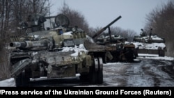 Destroyed Russian tanks are seen in the Sumy region of Ukraine on March 7. Was the Kremlin plan to invade Ukraine based on flawed intelligence? Or was it good intelligence that was misused?
