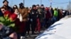 Mourners line up to visit Aleksei Navalny's grave at Borisovskoye cemetery in Moscow on March 3.