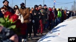 Mourners line up to visit Aleksei Navalny's grave at Borisovskoye cemetery in Moscow on March 3.