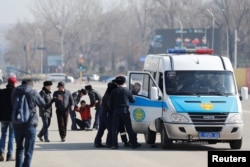 Kazakh police detain protesters during an opposition rally in Almaty in March 2020.