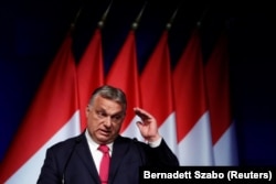 Hungarian Prime Minister Viktor Orban speaks during a business conference in Budapest on June 9.