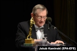 Norman Davies speaks after an award in Warsaw in January 2018. He is revered in Poland for his many books about the country.