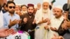 Manzoor Pashteen (center), the leader of the Pashtun Tahafuz Movement, is inaugurated at a jirga , or assembly, on September 29.